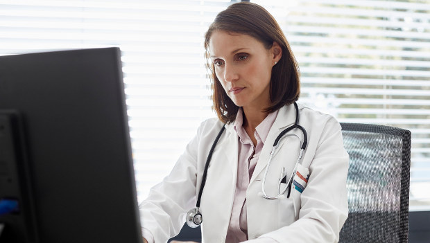 woman-doctor-desk-computer-2col.jpg