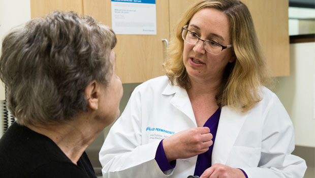 Dr. Sascha Dublin talks with a patient.