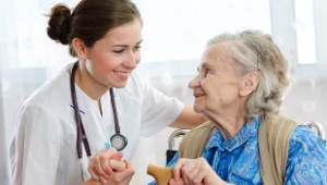 Old_woman_holding_hands_with_female_caregiver-1col.jpg