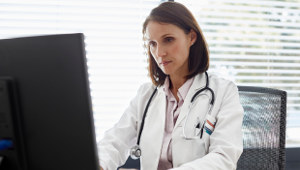 woman-doctor-desk-computer-1col.jpg