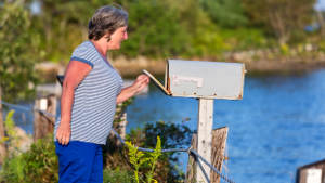 senior-woman-mailbox-lake-1col.jpg